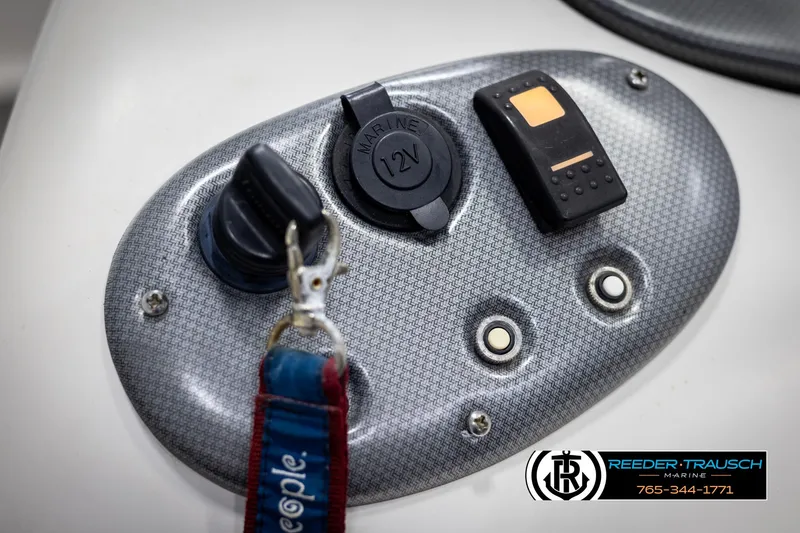 Slide: The Image of Control panel of 2015 Starcraft 1915 Limited OB boat with key and 12V outlet. - 29