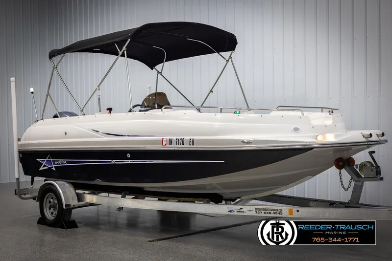 Slide: The Image of 2015 Starcraft 1915 Limited OB boat on trailer with canopy in showroom. - 3