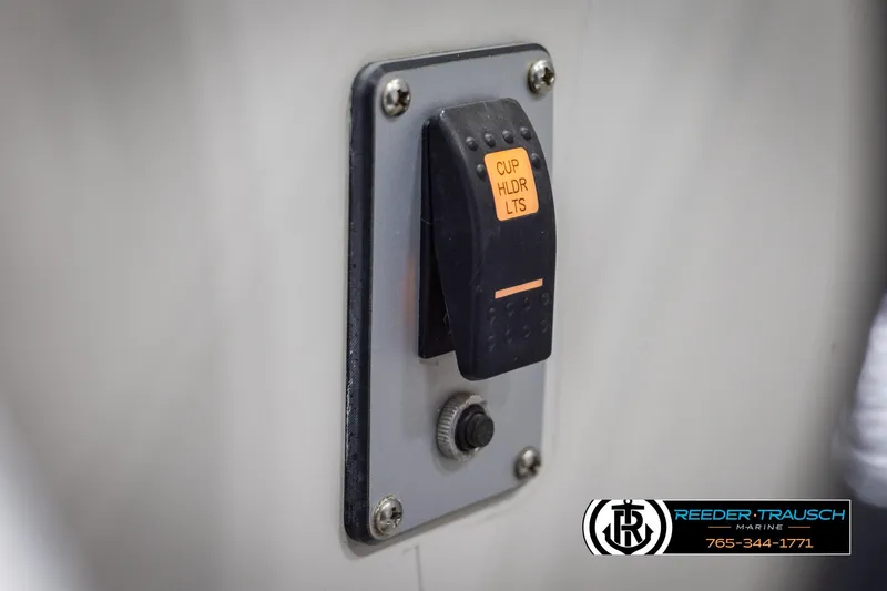 Slide: The Image of Switch panel on 2015 Starcraft 1915 Limited OB boat, labeled "Cup Holder LTS." - 33