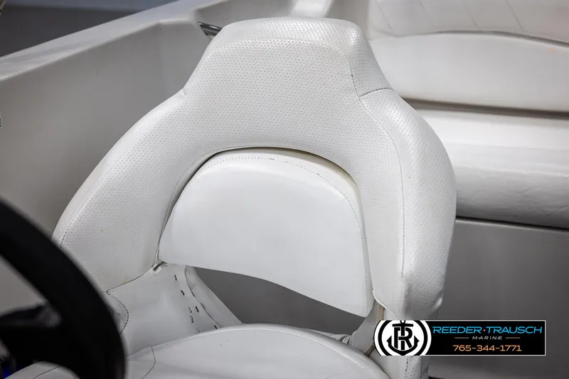Slide: The Image of 2015 Starcraft 1915 Limited OB boat seat, white upholstery, Reeder-Trausch Marine logo. - 34
