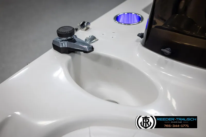 Slide: The Image of 2015 Starcraft 1915 Limited OB boat console with cup holder and control panel. - 38