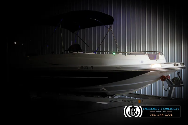 Slide: The Image of 2015 Starcraft 1915 Limited OB boat in dimly lit storage, side view. - 4