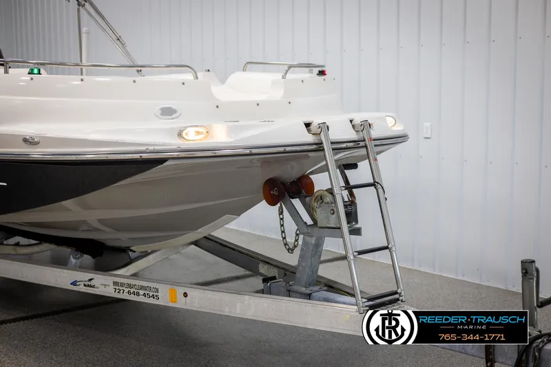 Slide: The Image of 2015 Starcraft 1915 Limited OB boat on trailer in indoor storage. - 48