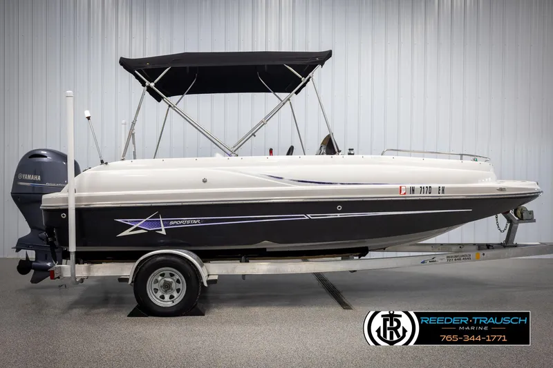 Slide: The Image of 2015 Starcraft 1915 Limited OB boat with trailer and canopy in a showroom. - 5