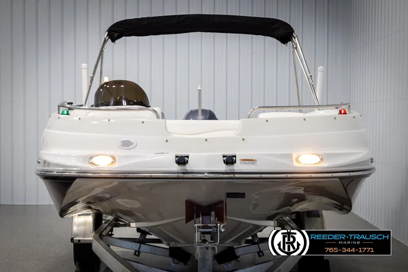 Slide: The Image of 2015 Starcraft 1915 Limited OB boat on trailer, front view in showroom. - 8