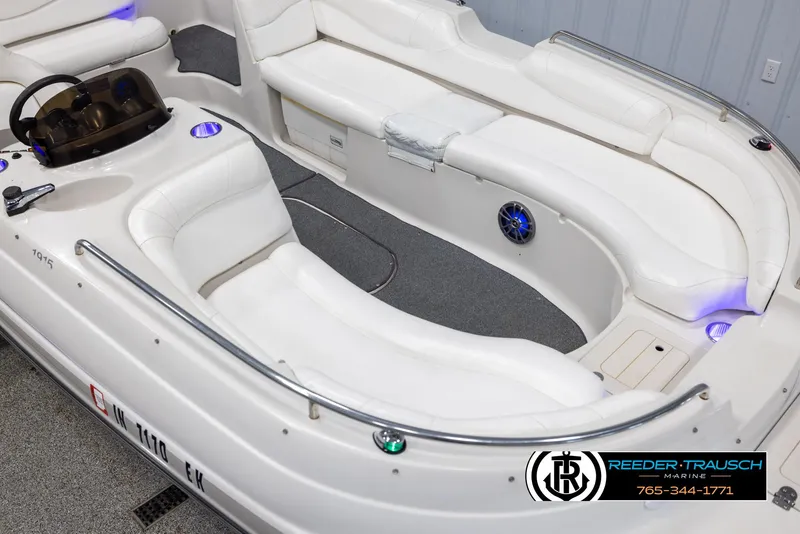 Slide: The Image of 2015 Starcraft 1915 Limited OB boat interior with white seating and modern dashboard. - 9