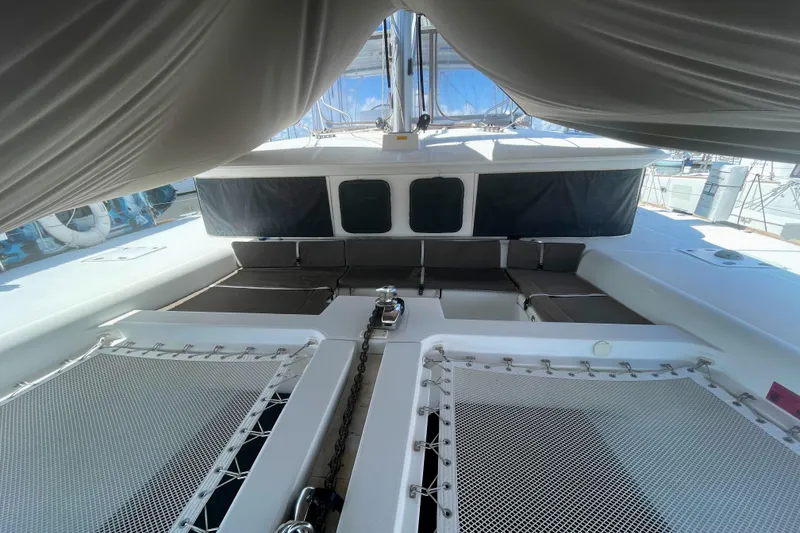 Slide: The Image of 2016 Lagoon 450 F catamaran deck with netting and seating area. - 17