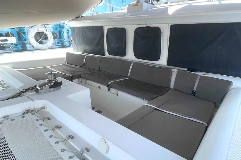 Slide: The Image of 2016 Lagoon 450 F catamaran with spacious outdoor seating area and modern design. - 18
