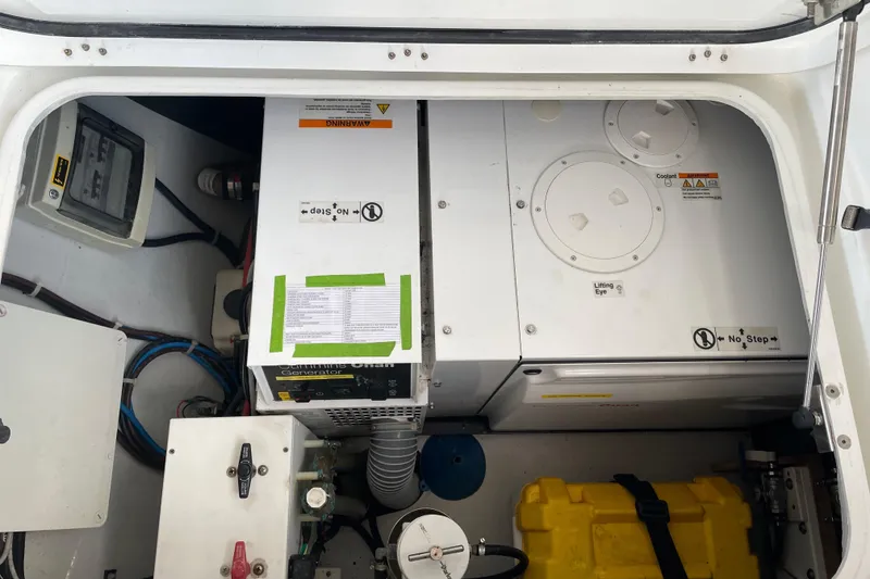 Slide: The Image of Engine compartment of a 2016 Lagoon 450 F catamaran, featuring mechanical and electrical components. - 19