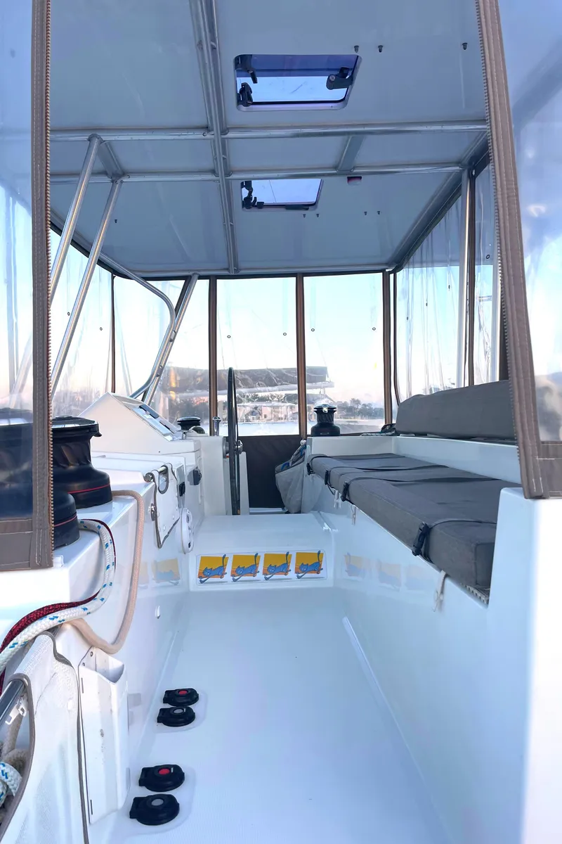 Slide: The Image of Interior view of 2016 Lagoon 450 F catamaran with seating and navigation area. - 24