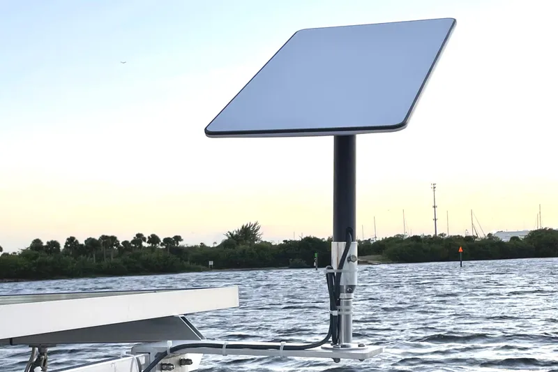 Slide: The Image of Satellite dish on Lagoon 450 F yacht, 2016 model, with water and trees in the background. - 38