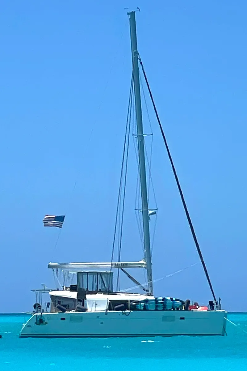 Slide: The Image of 2016 Lagoon 450 F catamaran sailing on clear blue waters. - 4