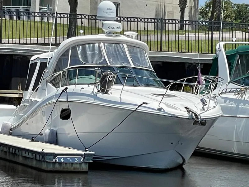 Slide: The Image of 2010 Sea Ray 350 Sundancer yacht docked at marina, front view. - 11