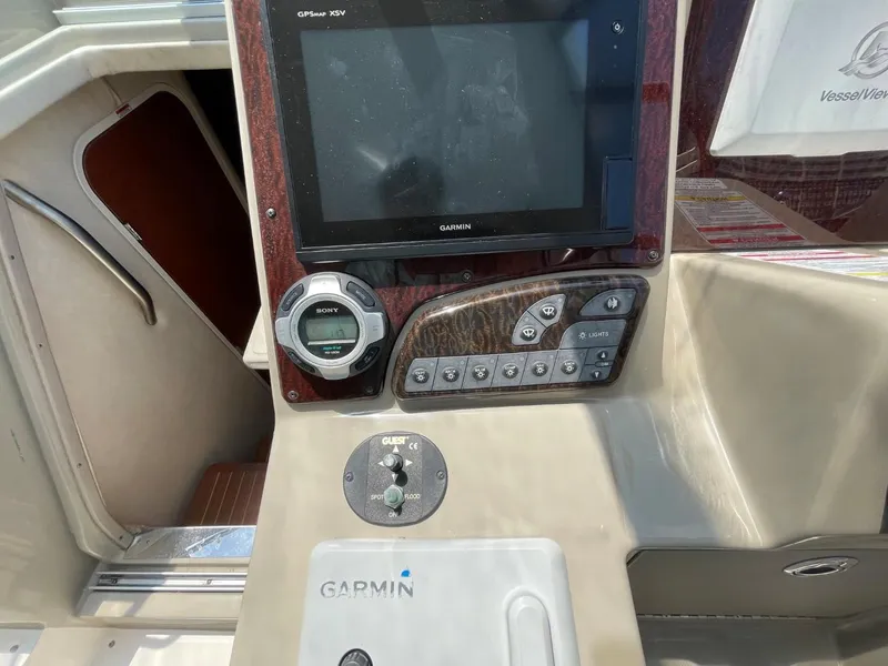Slide: The Image of Control panel of a 2010 Sea Ray 350 Sundancer with Garmin navigation system. - 18