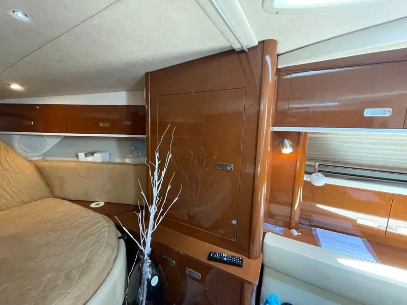 Slide: The Image of Interior of 2010 Sea Ray 350 Sundancer with wood finish and cozy seating area. - 34