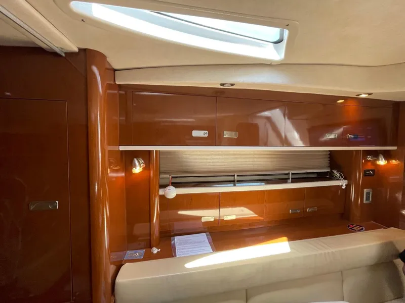 Slide: The Image of Interior of 2010 Sea Ray 350 Sundancer yacht with wood cabinetry and skylight. - 37
