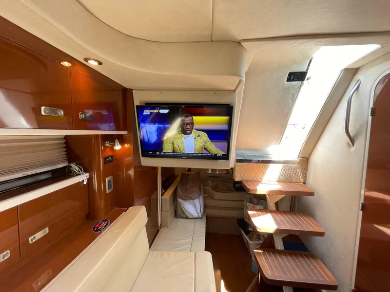 Slide: The Image of Interior of 2010 Sea Ray 350 Sundancer yacht with TV and seating area. - 41