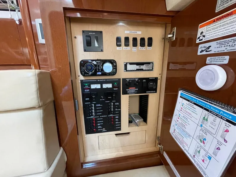 Slide: The Image of Control panel inside 2010 Sea Ray 350 Sundancer yacht, featuring switches and gauges. - 45