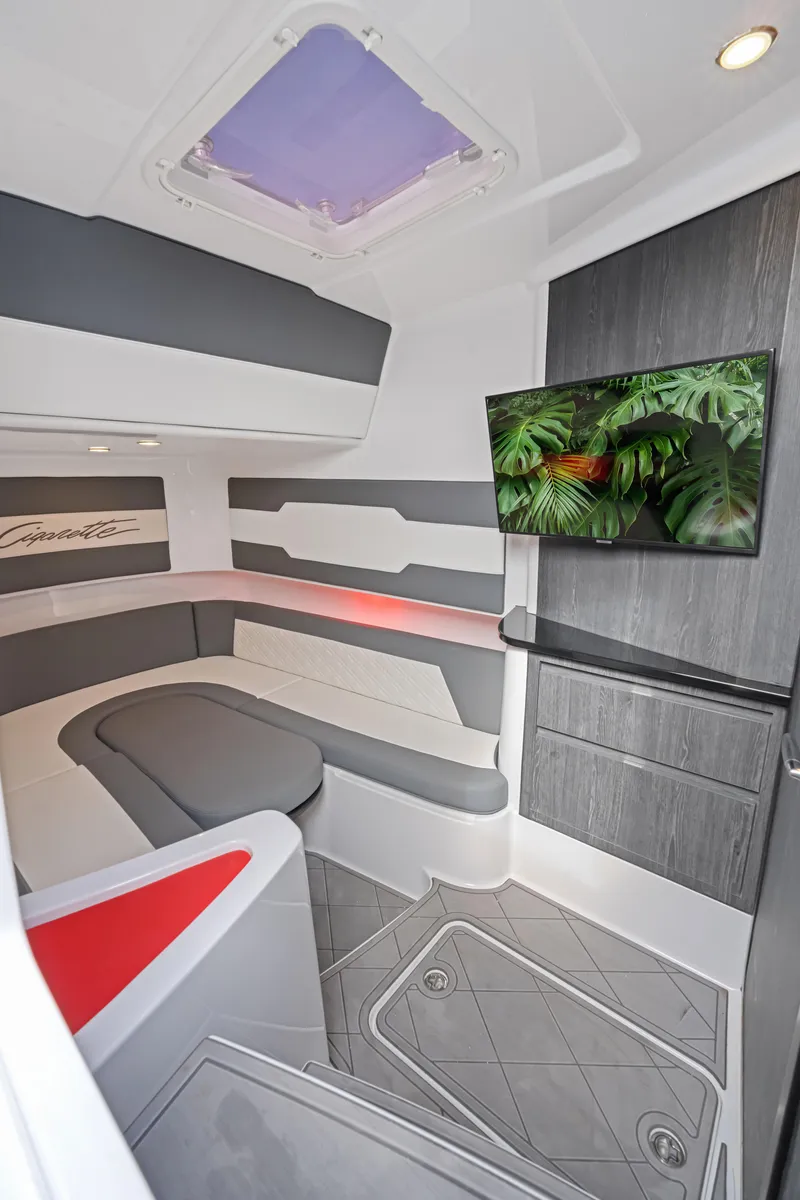 Slide: The Image of 2022 Cigarette 42 Auroris interior with modern seating, TV, and sleek design. - 28