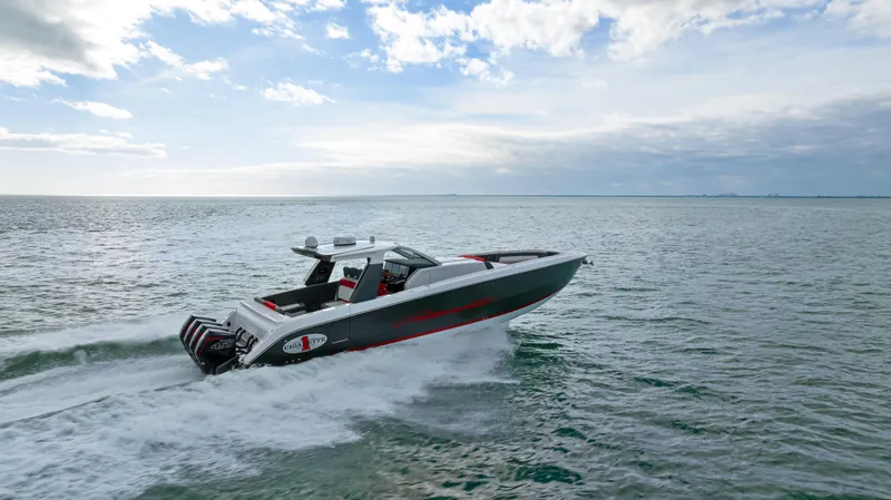 Slide: The Image of 2022 Cigarette 42 Auroris speedboat cruising on open water under a cloudy sky. - 38