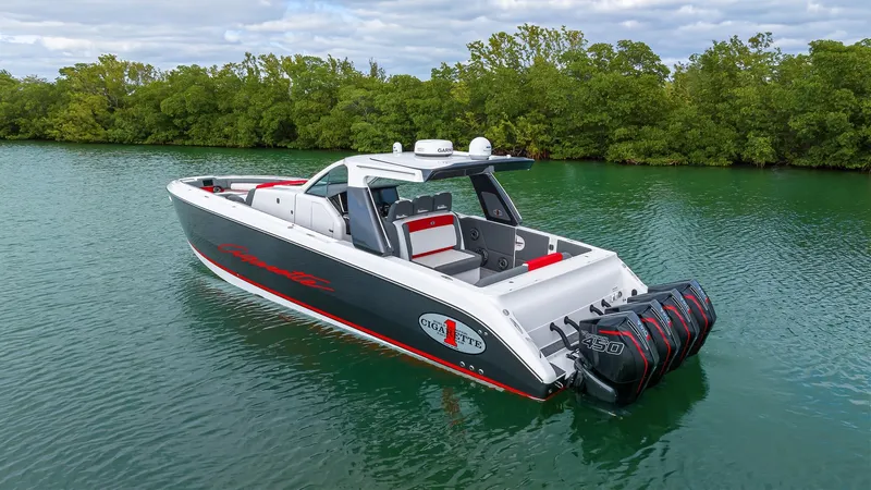 Slide: The Image of 2022 Cigarette 42 Auroris boat on calm water, featuring sleek design and powerful engines. - 4