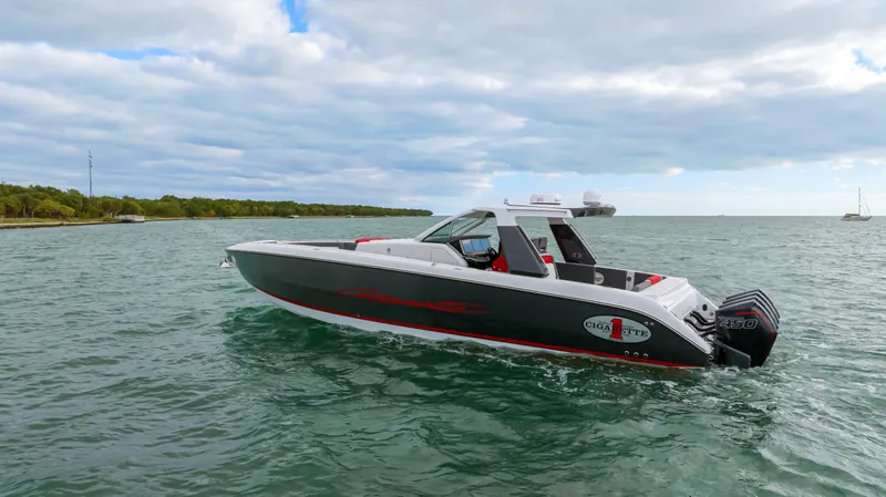 Slide: The Image of 2022 Cigarette 42 Auroris boat cruising on open water under cloudy sky. - 42