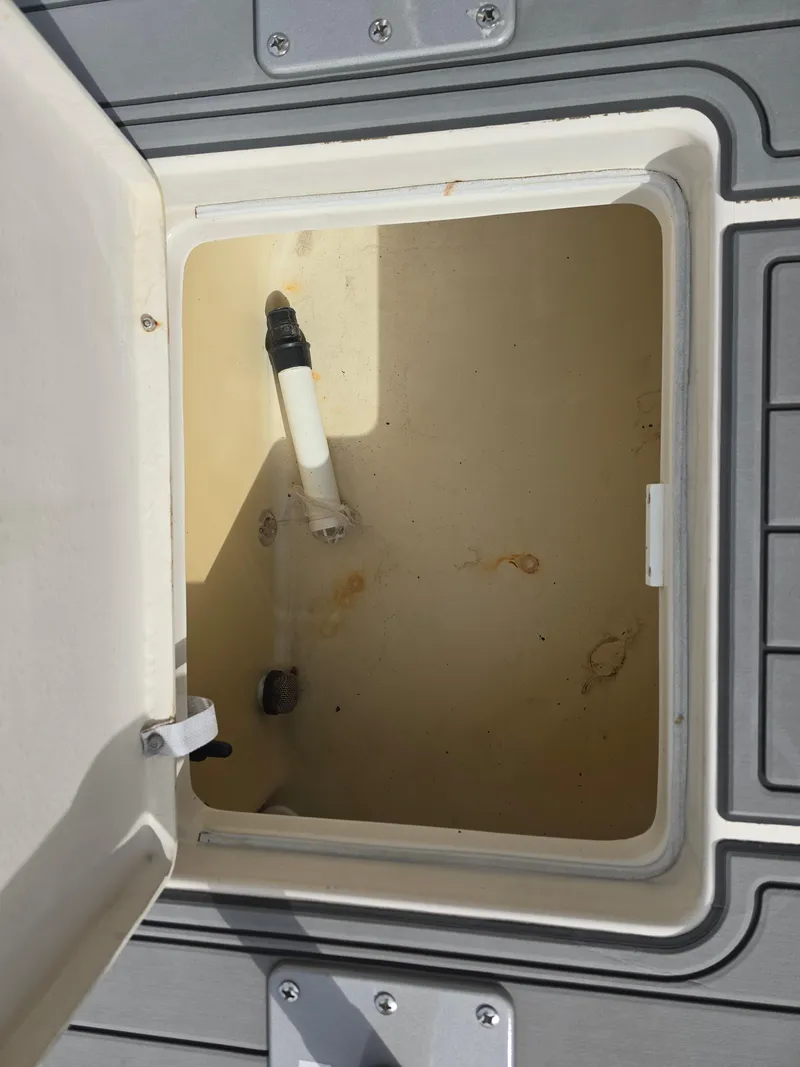 Slide: The Image of Open storage compartment on a 2006 Pathfinder 2400 TRS boat. - 10