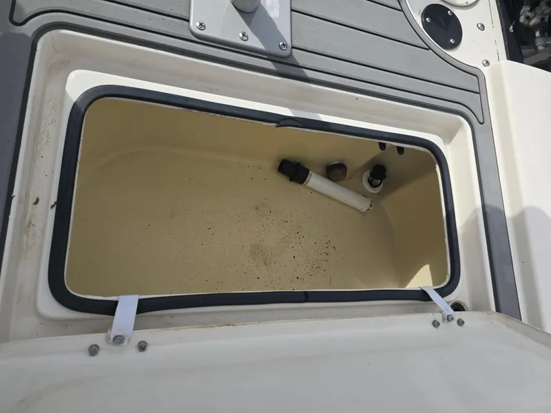 Slide: The Image of Open storage compartment on 2006 Pathfinder 2400 TRS boat deck. - 11