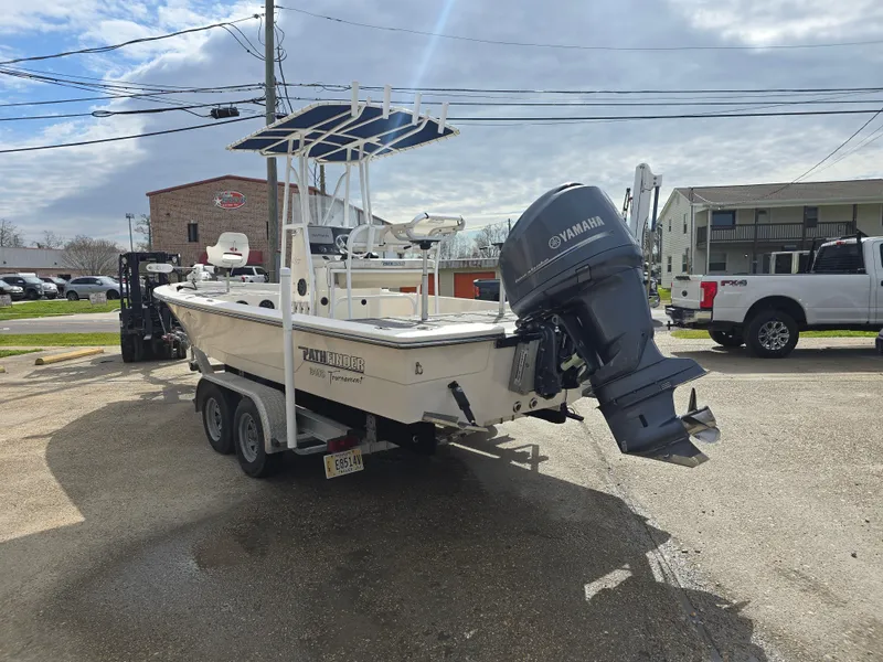 Slide: The Image of 2006 Pathfinder 2400 TRS boat on trailer with Yamaha outboard motor, parked outdoors. - 5