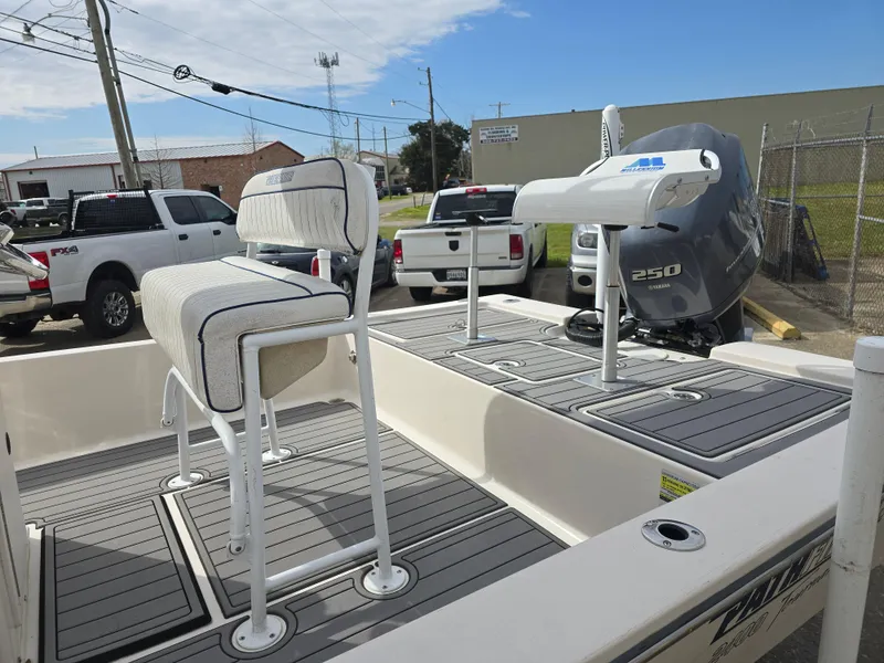Slide: The Image of 2006 Pathfinder 2400 TRS boat with seating and 250 horsepower engine, parked outdoors. - 8