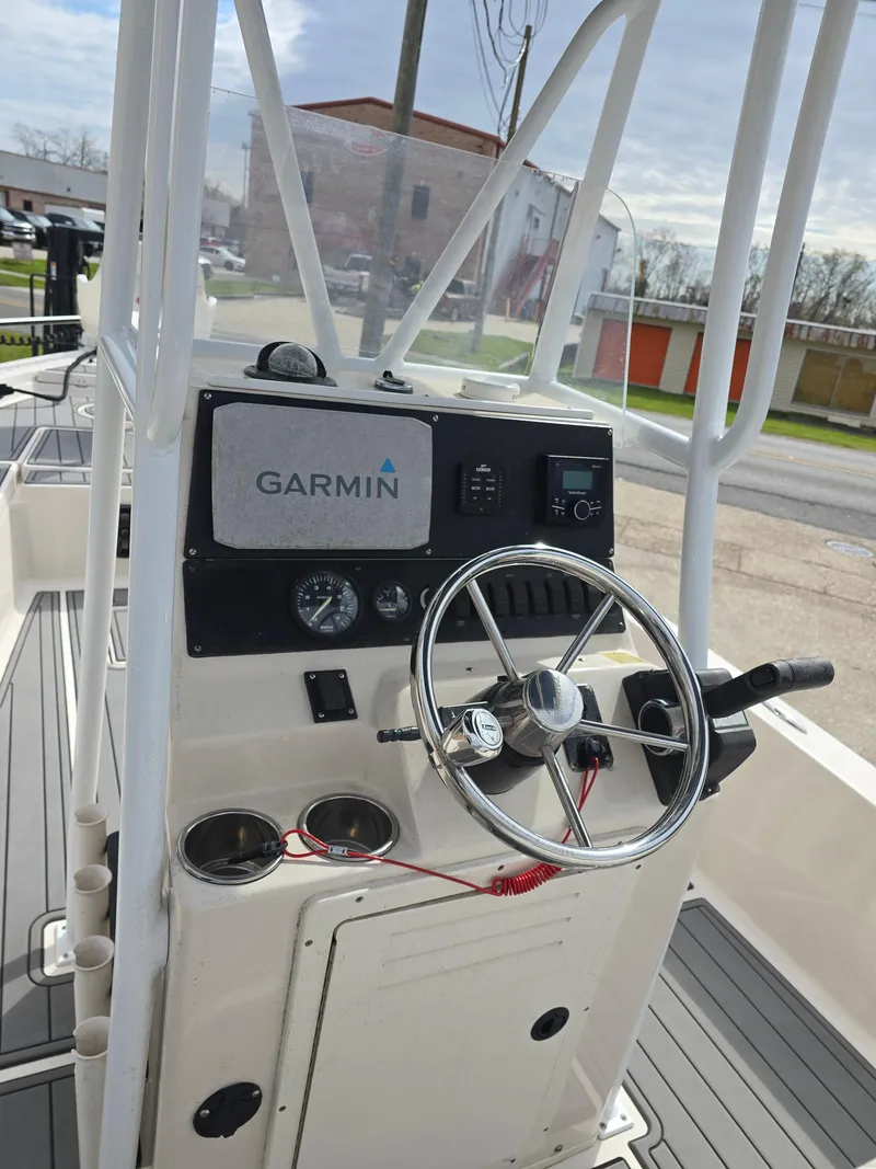 Slide: The Image of 2006 Pathfinder 2400 TRS boat console with Garmin navigation system and steering wheel. - 9