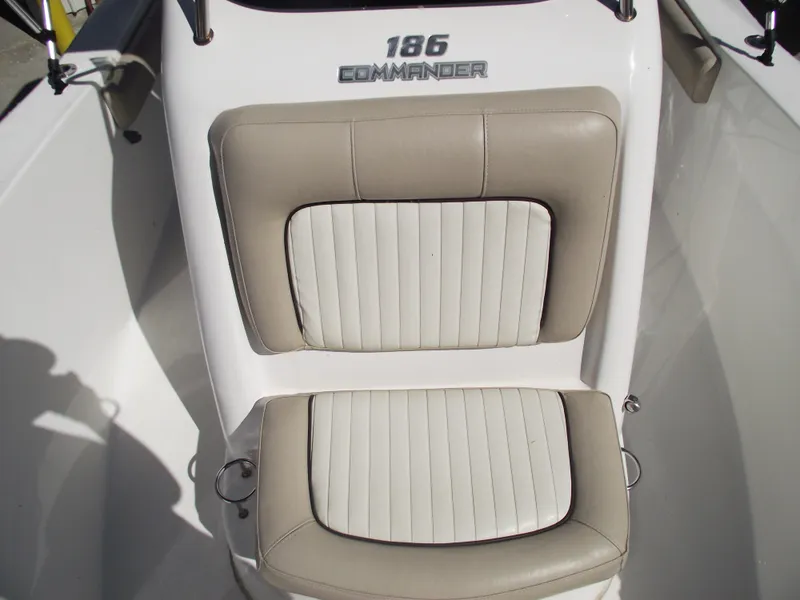 Slide: The Image of 2016 Sea Fox 186 Commander boat seating with beige and white upholstery. - 13