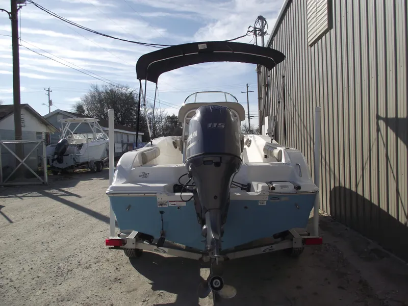 Slide: The Image of 2016 Sea Fox 186 Commander boat with Yamaha outboard motor, parked outdoors. - 3