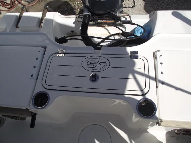 Slide: The Image of 2016 Sea Fox 186 Commander boat deck with storage compartment and cup holders. - 32