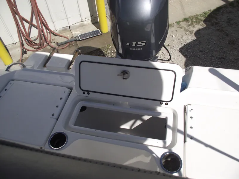 Slide: The Image of 2016 Sea Fox 186 Commander boat with open storage compartment and Yamaha 115 engine. - 33