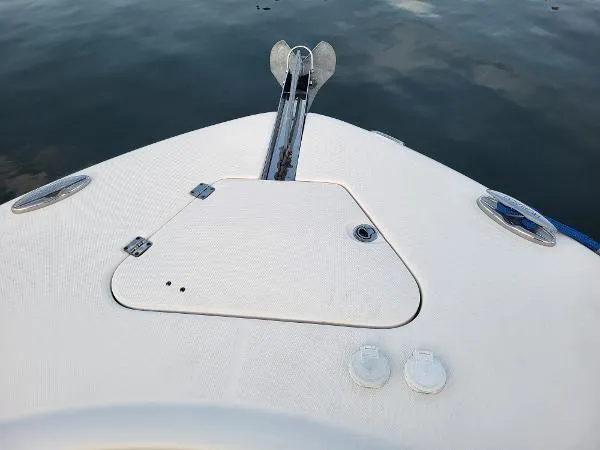 Slide: The Image of 2014 Robalo R 300 boat deck with anchor, on calm water. - 13