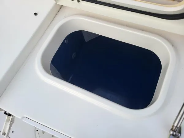 Slide: The Image of Livewell on 2014 Robalo R 300 boat, featuring a sleek white design. - 17