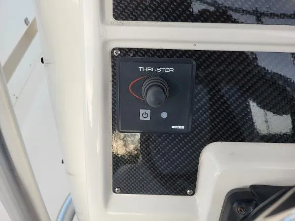 Slide: The Image of Thruster control panel on 2014 Robalo R 300 boat dashboard. - 21