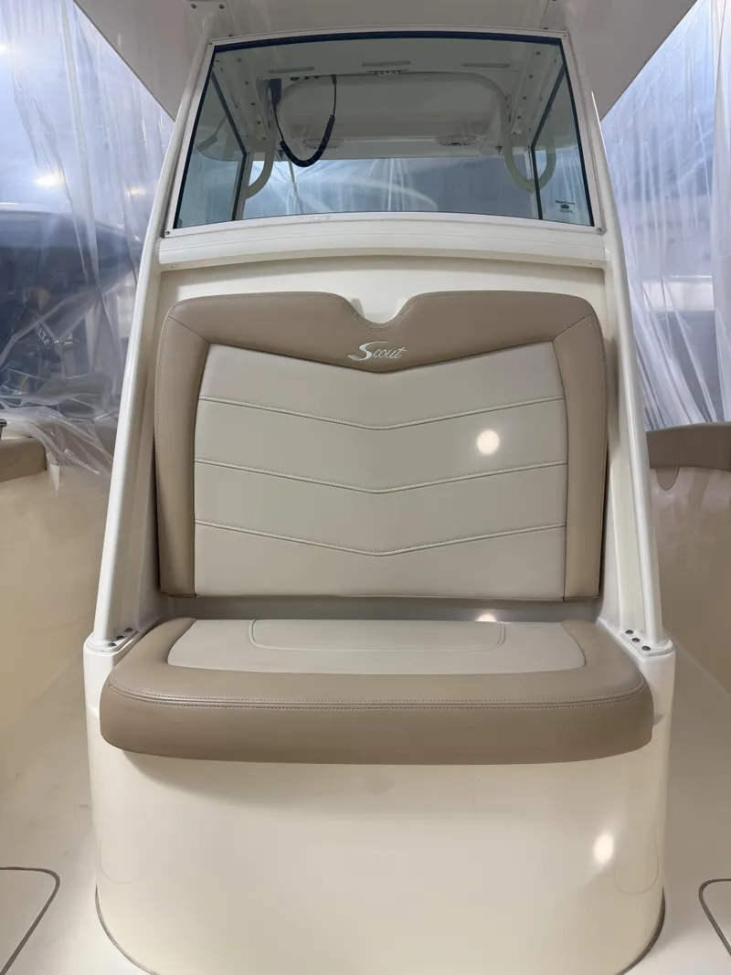 Slide: The Image of 2022 Scout 255 LXF boat seat with beige and cream upholstery. - 15