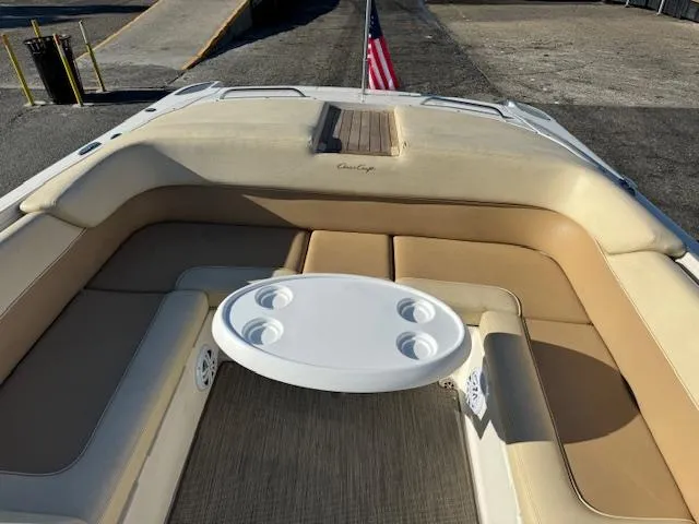 Slide: The Image of Interior of a 2007 Chris-Craft Corsair 28 with seating area and table. - 11