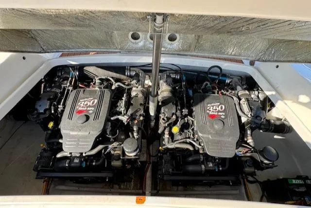 Slide: The Image of 2007 Chris-Craft Corsair 28 engine view, featuring twin 350 MAG MPI engines. - 17