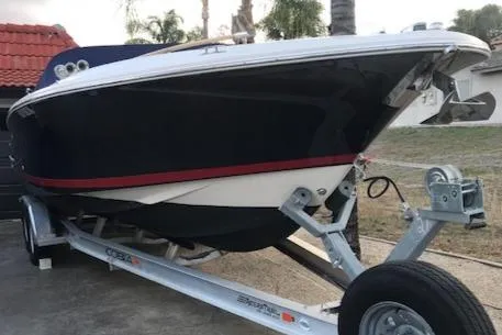 Slide: The Image of 2007 Chris-Craft Corsair 28 boat on trailer, side view. - 19