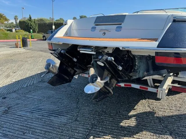 Slide: The Image of 2007 Chris-Craft Corsair 28 boat hull with dual engines on trailer. - 23
