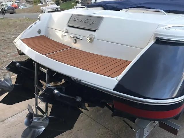 Slide: The Image of Rear view of a 2007 Chris-Craft Corsair 28 boat with wooden deck. - 25