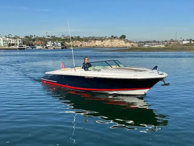 Slide: The Image of 2007 Chris-Craft Corsair 28 boat on calm water. - 3