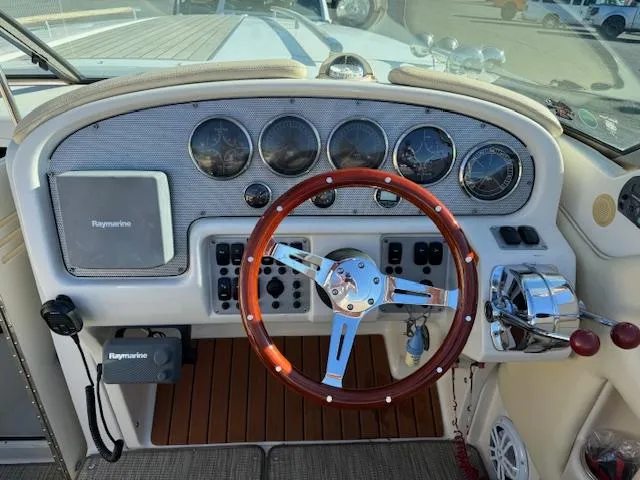Slide: The Image of Dashboard of a 2007 Chris-Craft Corsair 28 with wooden steering wheel. - 8