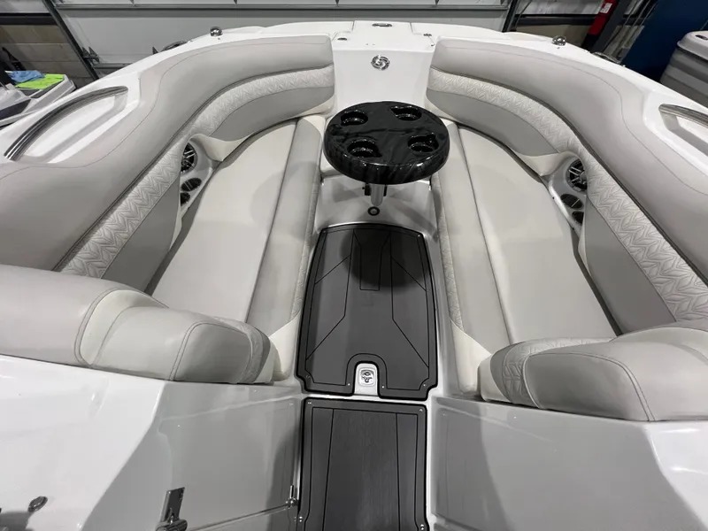 Slide: The Image of 2021 Hurricane SunDeck 2690 OB interior with plush seating and central table. - 12