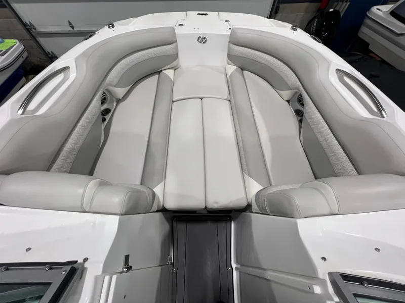 Slide: The Image of 2021 Hurricane SunDeck 2690 OB boat interior with spacious, cushioned seating in white and gray. - 13