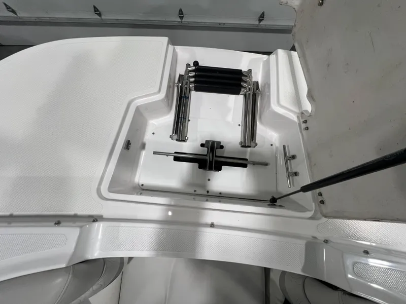 Slide: The Image of 2021 Hurricane SunDeck 2690 OB boat storage compartment with hydraulic components. - 15