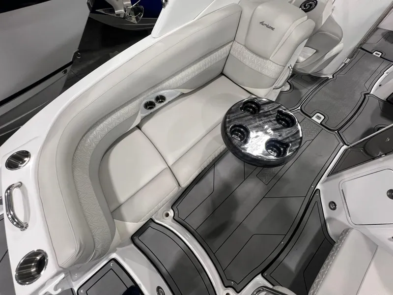 Slide: The Image of 2021 Hurricane SunDeck 2690 OB boat interior with plush seating and cup holders. - 4